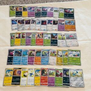 Assorted Pokémon Trading Cards. 50 Count